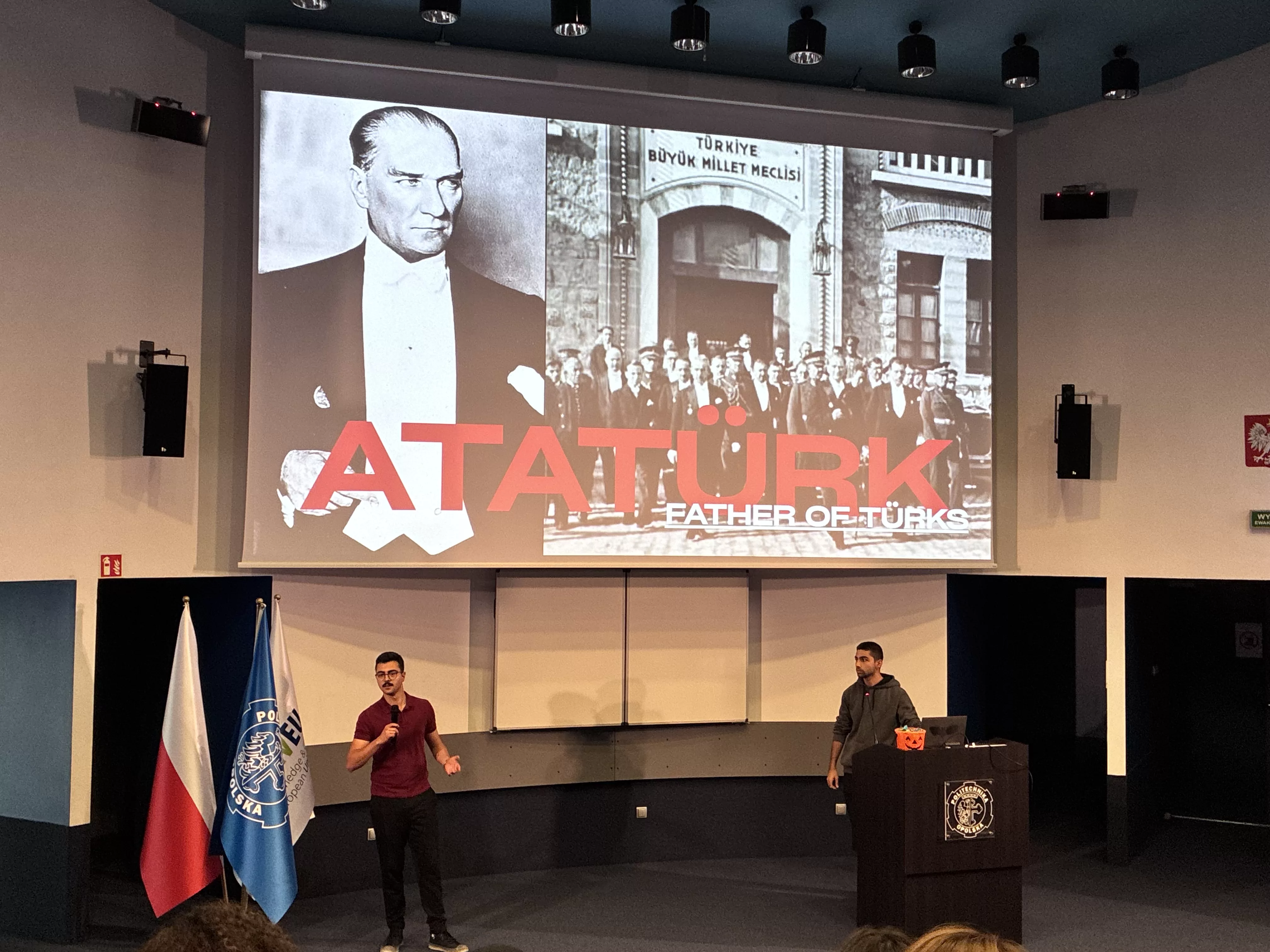 Presentation on Atatürk, featuring historical images and speakers discussing his impact as the Father of Turks.