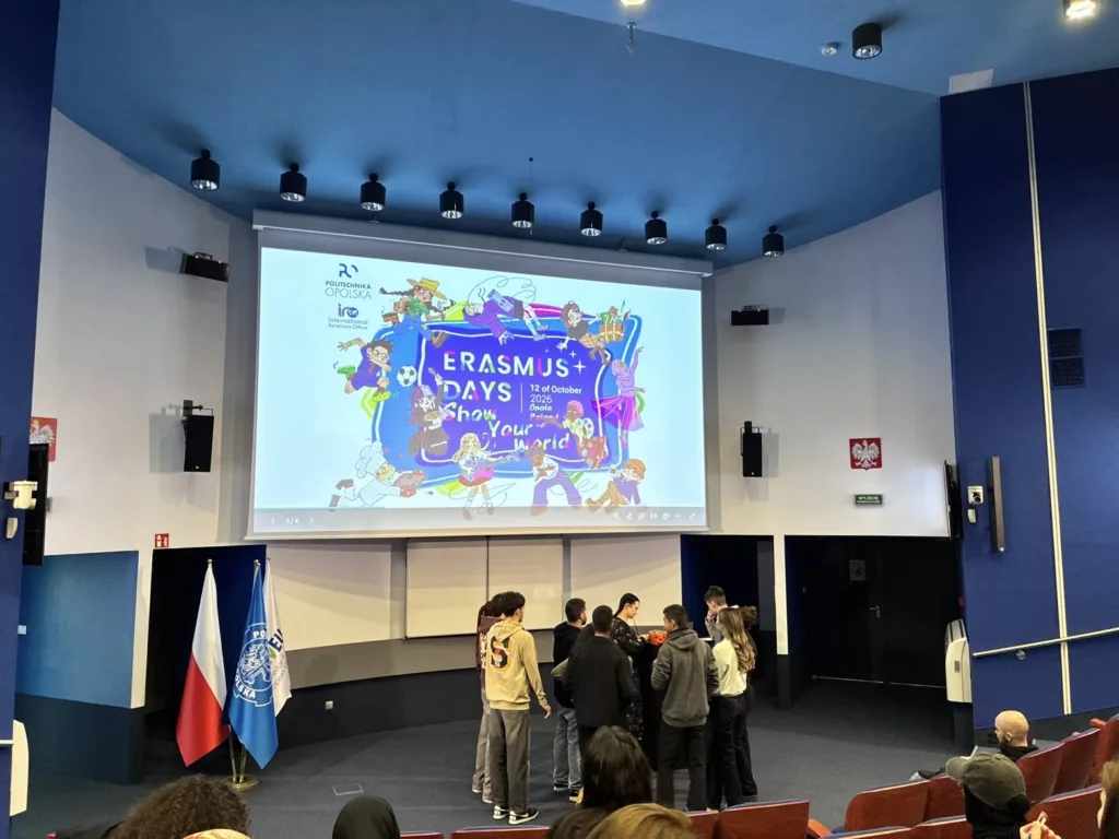 Erasmus+ Days event with students engaging on stage in front of a colorful presentation about showcasing their world.